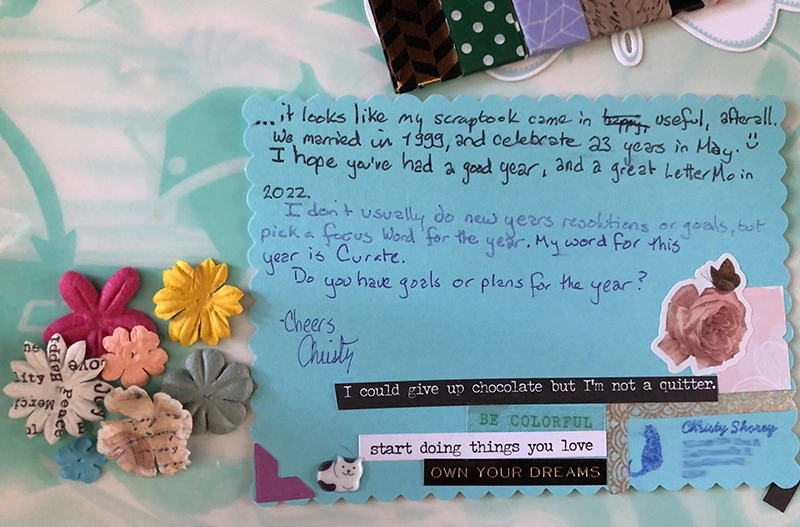 Card decorated with stickers, and with paper flower and washi-tape inserts.